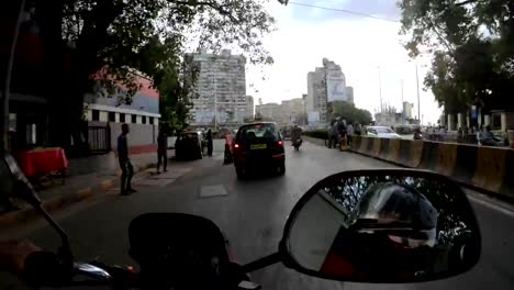 POV-motorcyclist-slips-through-traffic-in-central-streets-of-Mumbai-timelapse