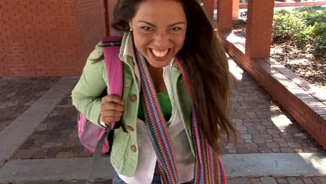 Young-latina-student-walking-towards-the-camera.