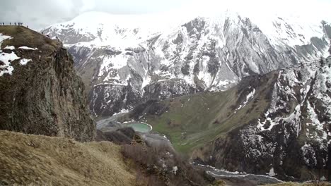 Tourists-on-the-edge-of-Mountain-cliff-in-Georgia