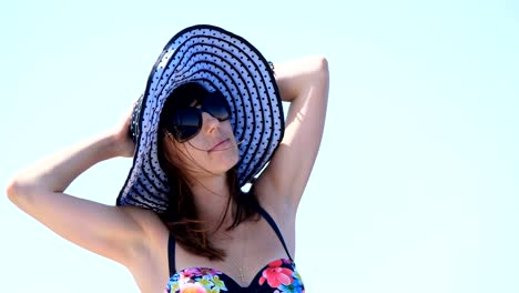 summer,-sea,-portrait-of-a-beautiful-young-brunette-woman-wearing-a-bathing-suit-and-sun-hat,-sunglasses,-standing-on-a-ferry-deck,-enjoying-rest,-beauty-of-the-sea,-happy,-smiling