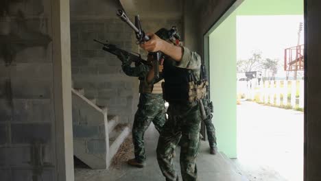 Squad-of-Fully-Equipped-and-Armed-Soldiers-Moving-Forward-to-Attack-and-Eliminate-Terrorist-Target-in-The-Building