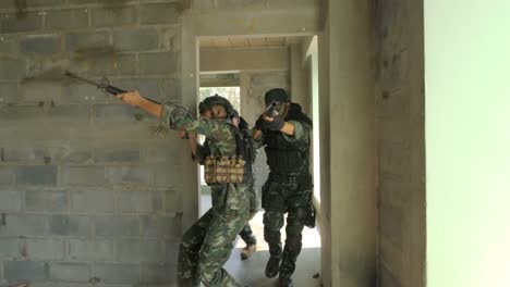 Squad-of-Fully-Equipped-and-Armed-Soldiers-Moving-Forward-to-Attack-and-Eliminate-Terrorist-Target-in-The-Building