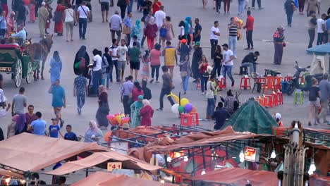 Crowds-of-pedestrians-walking-in-old-town-Medina-in-Marrakesh,-Morocco.