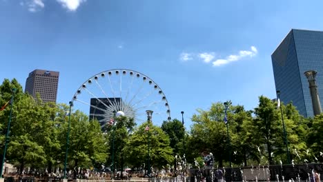 Atlanta-Centennial-Olympic-Park-Motion-Time-Lapse-with-sky-view-Ferris-wheel