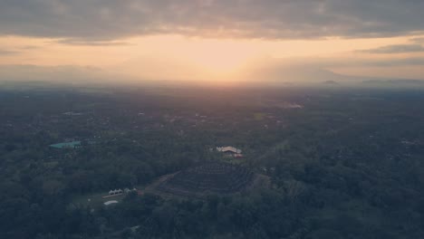 Borobudur-temple-aerial-view-at-sunrise-a-UNESCO-site-and-World-largest-Buddhist-temple,-Indonesia