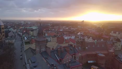 Drone-shot-flying-over-Lund-city-at-sunset.-Cathedral-church-building-in-the-background