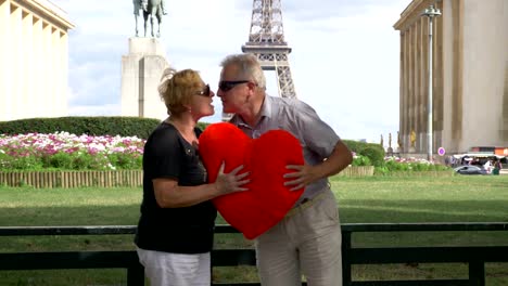 Senior-couple-kissing-in-front-of-Eiffel-tower-on-valentines-day-in-4k-slow-motion-60fps