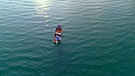 Tourists-fishing-on-a-boat-in-river-4k