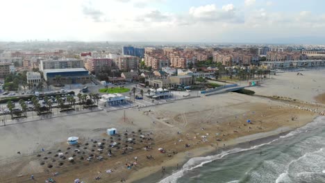 Aerial-view-over-the-beach-in-Valencia,-Spain.-Flight-drones-over-the-beach-in-Valencia.-View-of-the-tourist-city