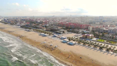 Aerial-view-over-the-beach-in-Valencia,-Spain.-Flight-drones-over-the-beach-in-Valencia.-View-of-the-tourist-city