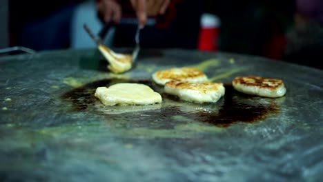 Street-Food-Vendor-making-Roti-Canai-on-a-frying-pan