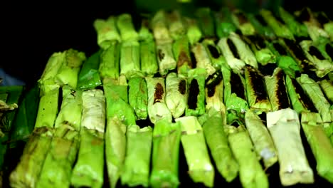 Food-Vendor-grilled-Sticky-Rice-at-Indonesian-Traditional-Cake-bazaar