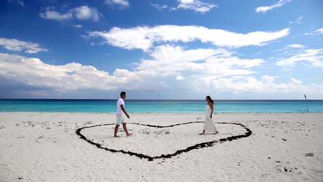 Young-beautiful-newlyweds-meet-each-other-on-beach