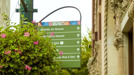 Panning-From-Historical-Building-To-Asheville,-NC-City-Signage