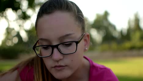 Cheerful-teenage-girl-showing-and-eating-grapes-in-front-of-camera