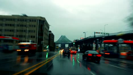 Time-Lapse-of-a-Rainy-evening-in-a-car-with-Bridge-in-Background