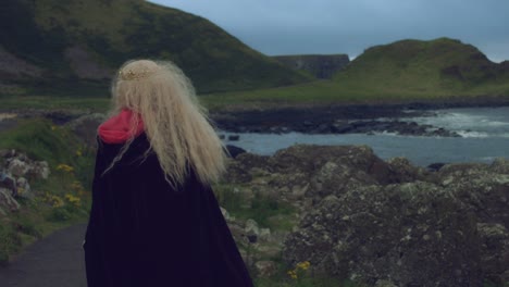 4k-Fantasy-Shot-of-a-Queen's-Face-smiling-at-Camera,-Giant's-Causeway-location