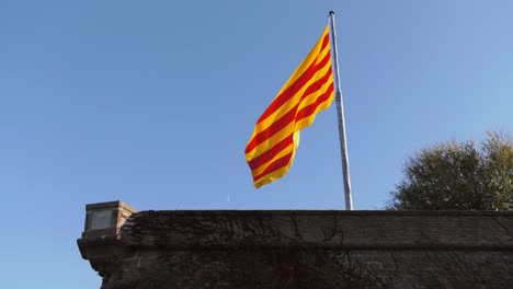 Spanish-Flag-Hanging-Out-Of-Castillo-de-Montjuic-Barcelona