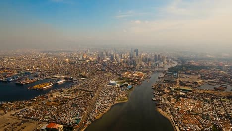 Luftbild-Stadt-mit-Wolkenkratzern-und-Gebäuden.-Philippinen,-Manila,-Makati