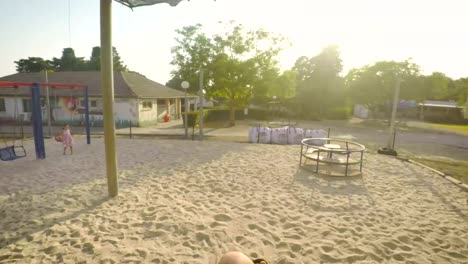 POV-footage-of-three-kids-playing-in-a-playground