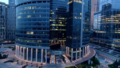 Night-aerial-view-of-skyscrapers.-Working-late-concept.-4K