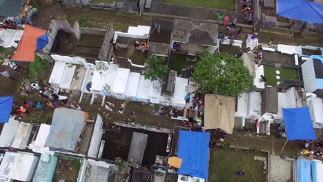 Messy-city-public-cemetery-parking-lot.-Turning-right-Drone-Aerial-Shot