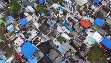 Messy-city-public-cemetery-parking-lot.-Turning-right-Drone-Aerial-Shot