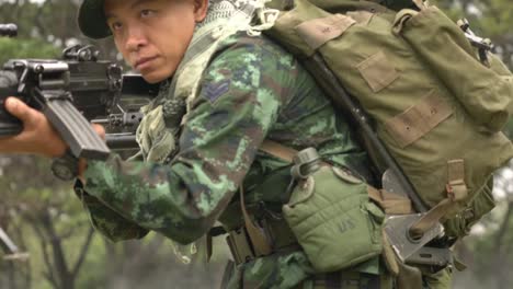 Soldier-holding-gun-weapon-and-waring-armor-uniform.-The-military-is-responsible-for-maintaining-the-territory.