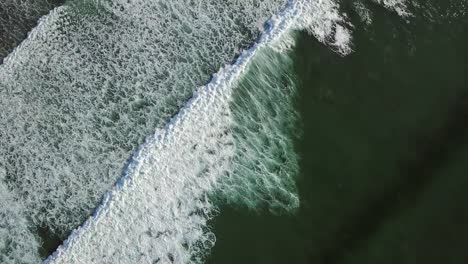 Aerial-tilt-view-on-ocean-waves-on-Atlantic-coast