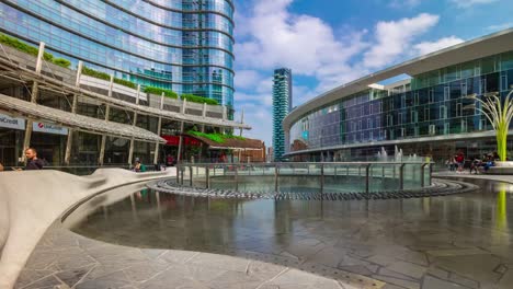 Italy-milan-city-sunny-day-famous-modern-block-fountain-square-panorama-4k-timelapse