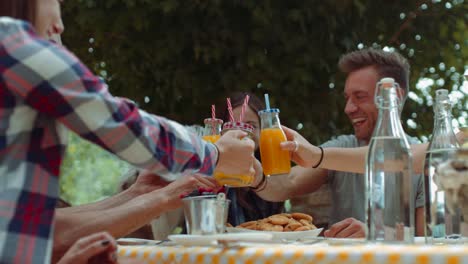 group-of-friends-doing-breakfast-outdoors-in-a-traditional-countryside.-shot-in-slow-motion