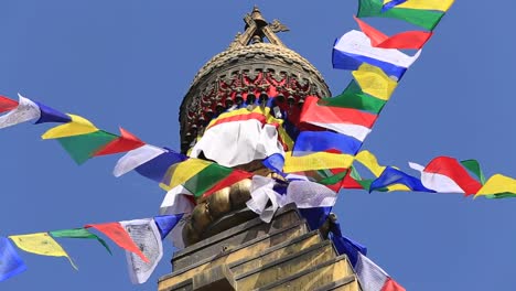 Colorful-flags-flying-from-Buddhist-Stupa-in-Kathmandu-valley,-Nepal