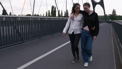 Girlfriends-Walking-Side-by-Side-and-Embracing