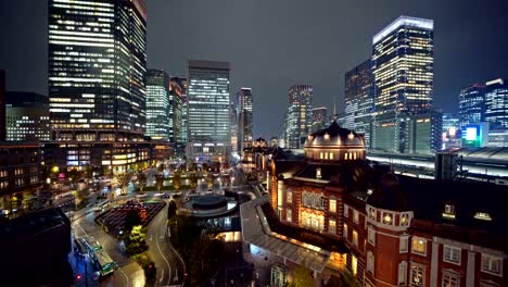 Tokyo-railway-station-with-high-rise-buildings.-Downtown-and-financial-district-and-business-centers-in-smart-urban-city-in-Tokyo-at-night,-Japan