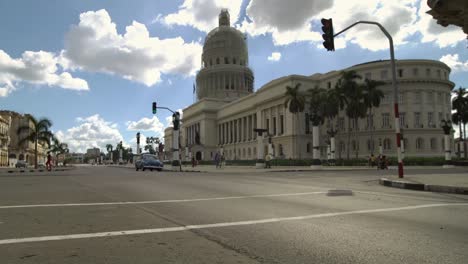 Iconic-view-of-vintage-classic-American-car-passing-on-the-street-of-Havana-city,-Cuba.