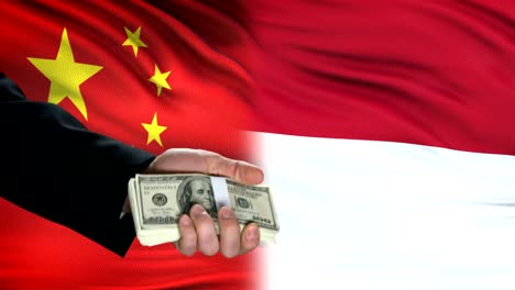 China-and-Indonesia-officials-exchanging-tank-for-money,-flag-background-defense