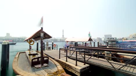 Boats-at-Port-Saeed-along-Deira's-shore-of-Dubai-Creek,-UAE.-Timelapse