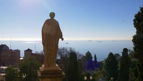 tarragona-statue-sun-light-view-on-mediterranean-sea-4k