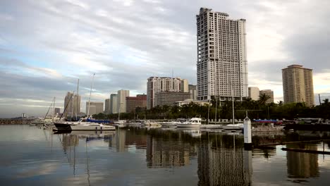 City-coast-wide-shot.-Dusk-to-day-Time-Lapse.-sunrise,-clouds.