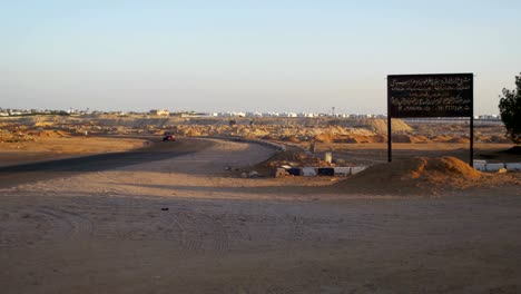 Car-goes-on-the-Road-to-Egypt-and-the-Arabic-Sign