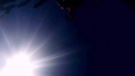 Shark-pov.-Underwater-shot-of-attractive-sexy-female-swimming-on-sea-surface