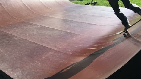 Young-male-skateboarder-on-a-skateboarding-ramp