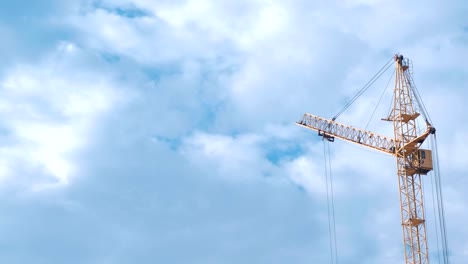 Construction-of-a-multi-storey-building.-House-and-construction-crane-on-sky-background.