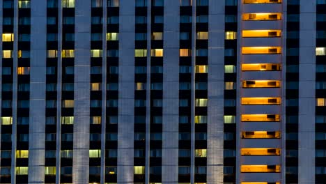 Illuminated-windows-of-hotel-,-time-lapse