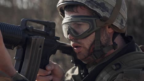 Israeli-soldier-pointing-his-rifle-and-scanning-the-area---close-up