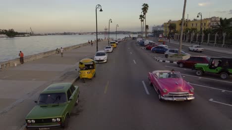 Classic-1950's-American-Vintage-Convertible-Taxi-Car-driving-on-malecon-street-Havana,-Cuba.