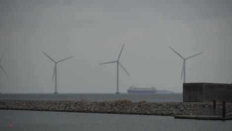 The-theme-is-net-power-generation-and-environmental-protection.-A-number-of-wind-blades,-wind-power-in-the-Baltic-Sea-in-Europe-Denmark-Copenhagen-in-winter