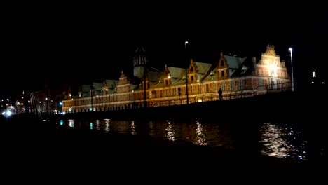 Houses-and-street-by-the-harbor-at-night