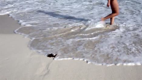 Woman-walking-on-the-beach