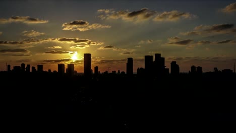 City-skyline-time-lapse-orange-sunset-into-night